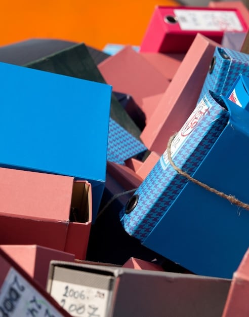 A close-up shot of various storage supplies, including acid-free paper, archival boxes, desiccant packets, microfiber cloths, and UV-resistant display cases. The items are neatly arranged on a clean surface, showcasing their protective qualities.