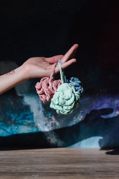 A close-up shot of a collector's hands gently dusting an anime figure with a soft, long-bristled brush. The background is blurred, highlighting various cleaning supplies neatly organized on a shelf, including microfiber cloths, gentle cleaning solutions, and cotton swabs.