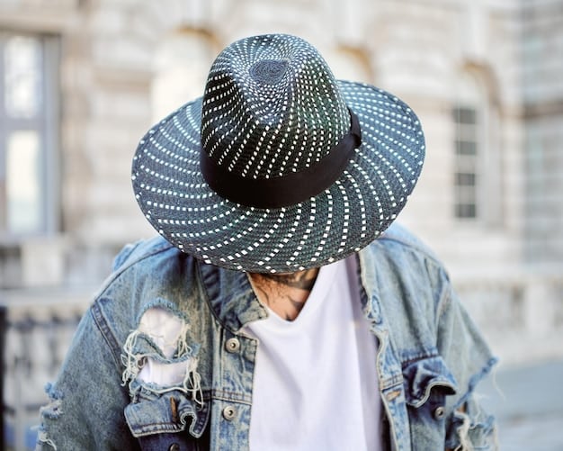 A street style shot of someone wearing a One Piece-inspired straw hat with a modern twist, paired with a casual outfit.