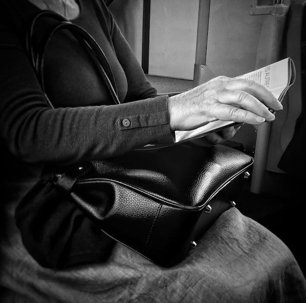 A black and white photo capturing a salaryman asleep on a train, his briefcase in his lap, symbolizing the exhaustion and long commutes associated with the demanding work culture in Japan. The image should be slightly blurred to emphasize the sense of fatigue and routine.