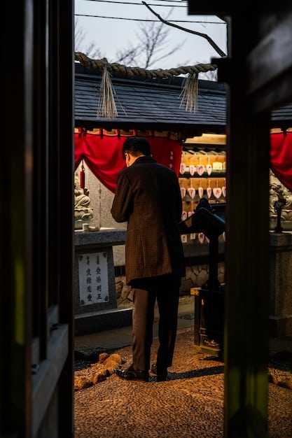 A scene from a J-drama showing a character visiting a Shinto shrine, with focus on the visual elements that represent Japanese religious traditions, such as torii gates, komainu statues, and ema (votive tablets).