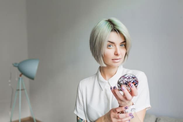 A person dipping a white cosplay wig into a container of fabric dye in a sink. They are wearing gloves, and the surrounding area is covered with protective materials to prevent staining. The dye is a vibrant color, and the wig is partially submerged.
