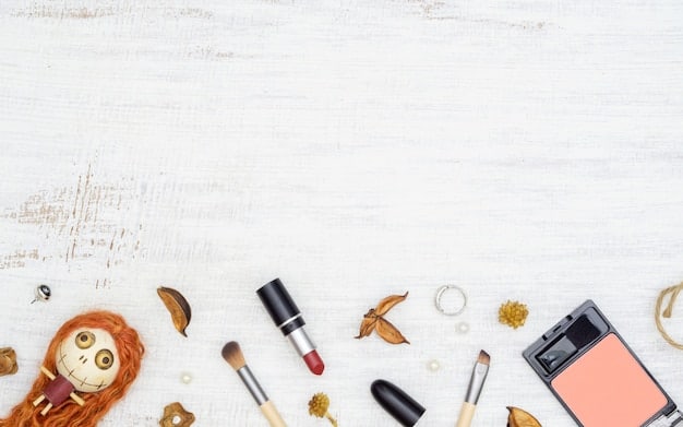 A clear, well-organized table displaying a variety of makeup and crafting supplies used for creating fake blood and gore. Items include different shades of food coloring, corn syrup, cocoa powder, gelatin, makeup sponges, brushes, and empty containers for mixing.