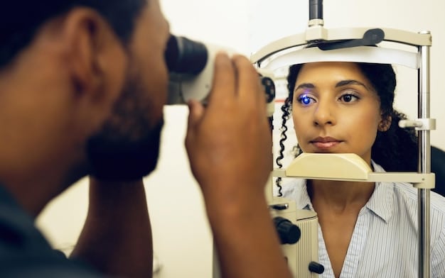 A close-up of an eye exam where an optometrist is using specialized equipment to examine the fit of a contact lens on a patient's eye. The focus is on the interaction between the lens and the eye surface.