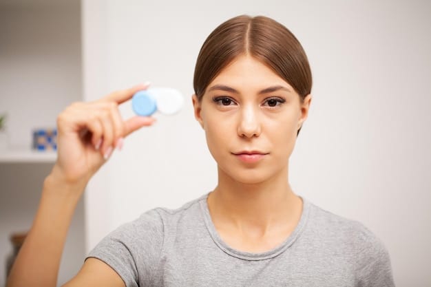 A person demonstrates the correct method of cleaning contact lenses by gently rubbing the lens with their fingertip over the palm of their hand, using contact lens solution. The focus is on the lens and cleaning process.