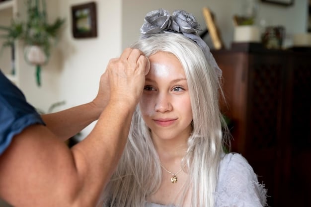A person carefully applying wig glue along their hairline, preparing to secure a white lace-front wig. The focus is on the precise application and the clean hairline.