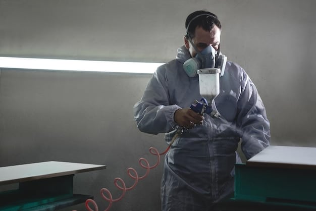 A prop maker wearing a respirator and gloves, carefully applying paint to a detailed prop using an airbrush in a well-ventilated workshop. The image emphasizes safety and precision.