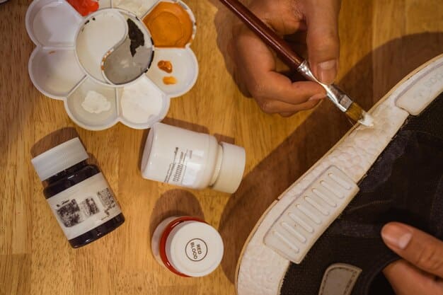 A close-up shot of a cosplayer carefully painting details onto a pair of plain shoes, transforming them into character-specific footwear. The focus is on the precision and artistry involved in modifying the shoes, highlighting the use of fine brushes and vibrant paints.